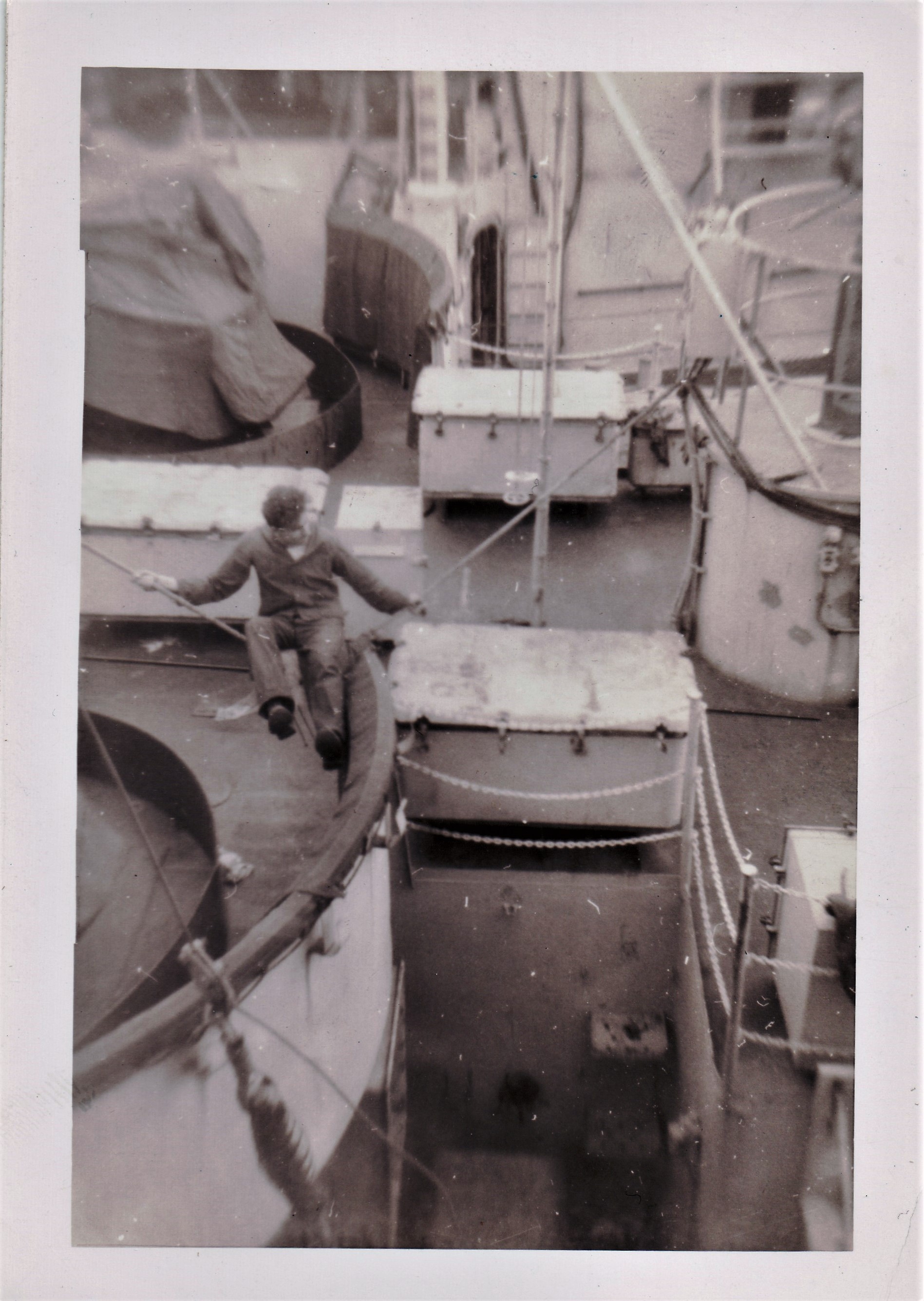 A ship tied up along side of USS Dale W Peterson